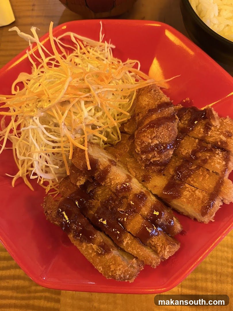 Fried cutlet with shredded salad and rice