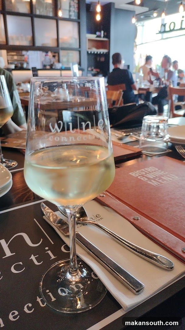 Wine Glass and Menu at a Bistro