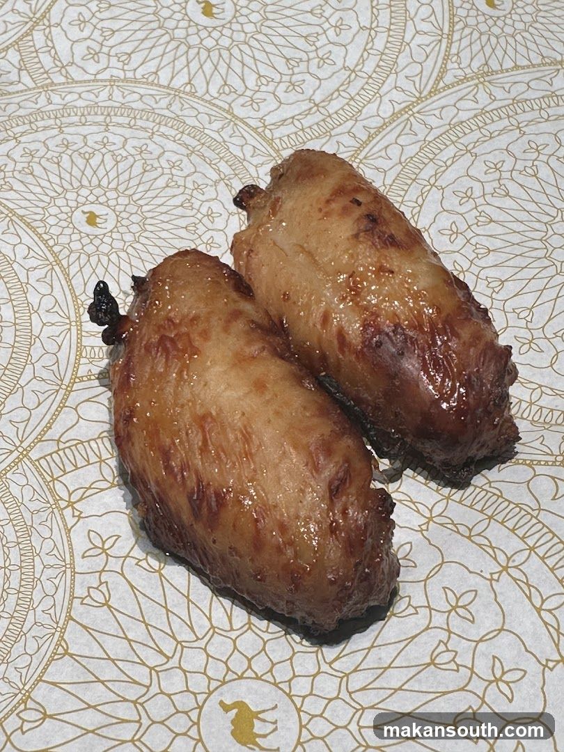 Two glazed chicken wings