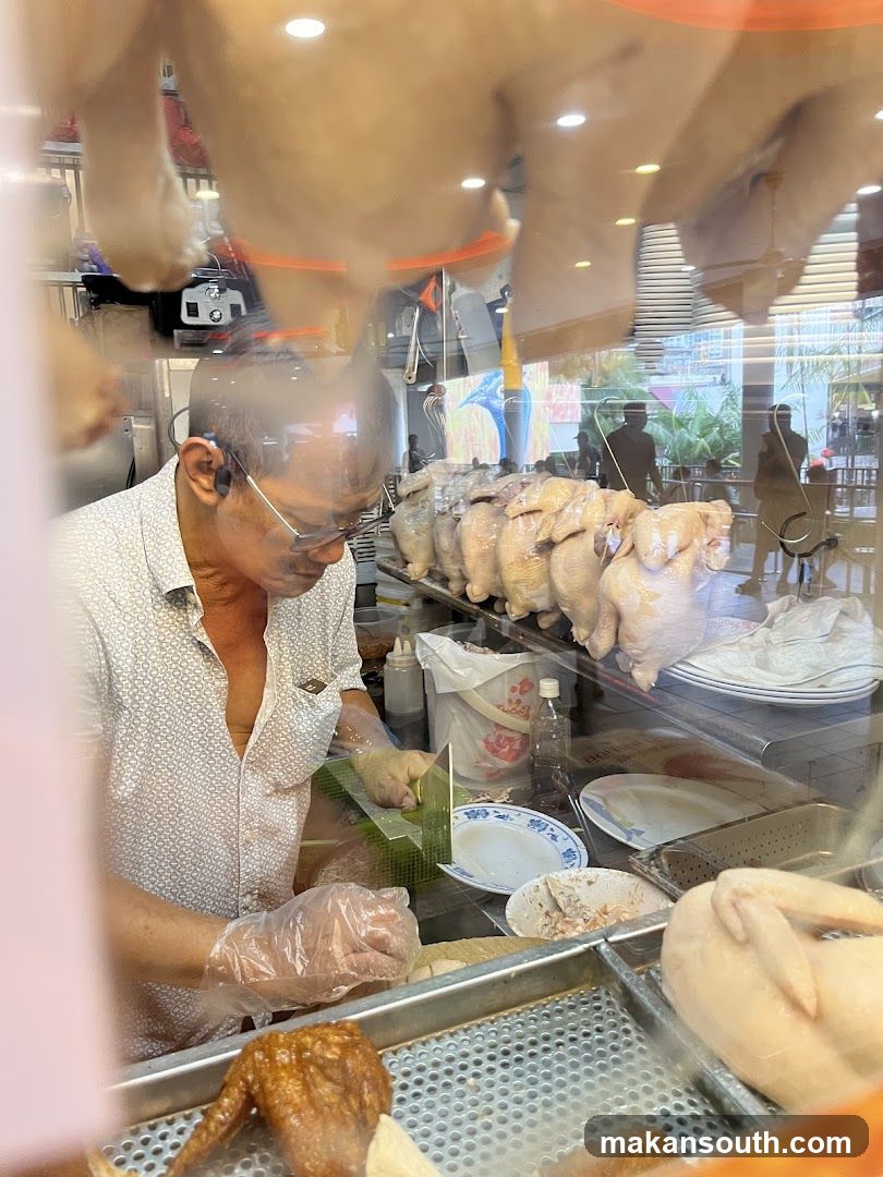 Butcher preparing chicken