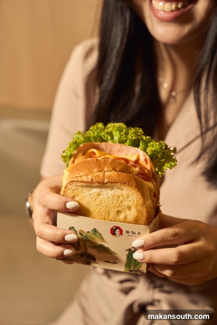 Woman holding a sandwich