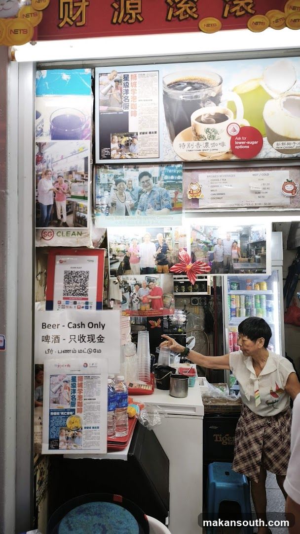 Food stall with drinks and promotional materials