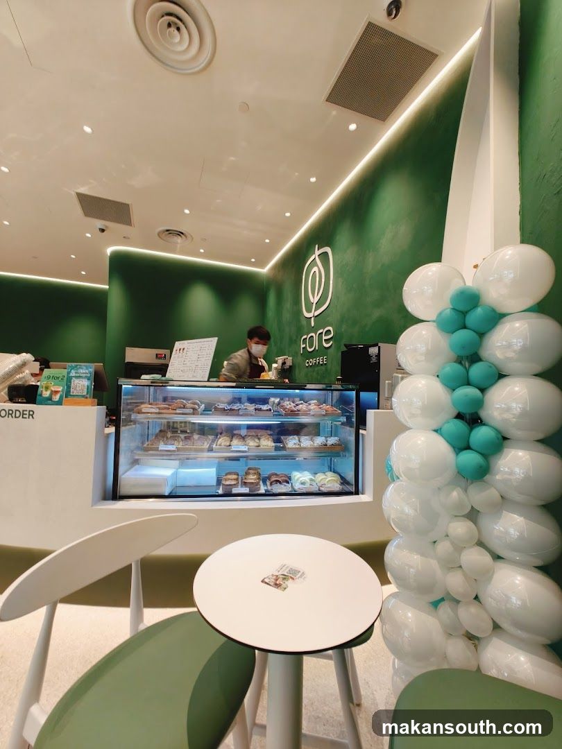 Coffee shop interior with pastries and balloons