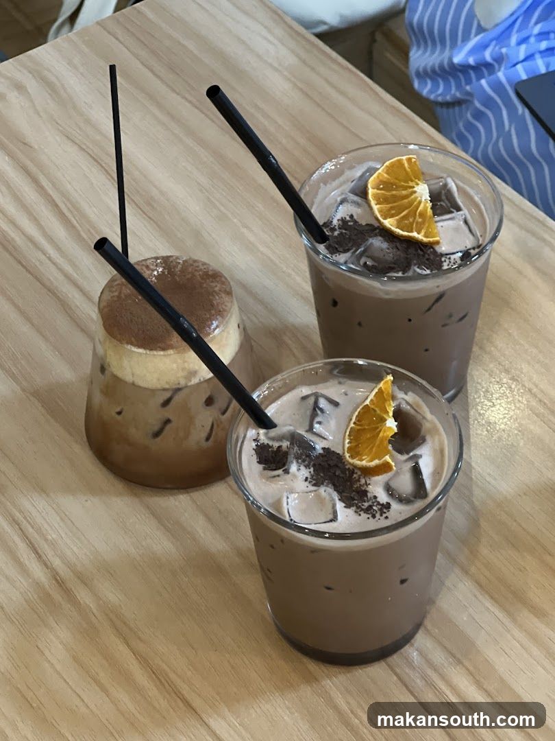 Three Iced Drinks on a Wooden Table