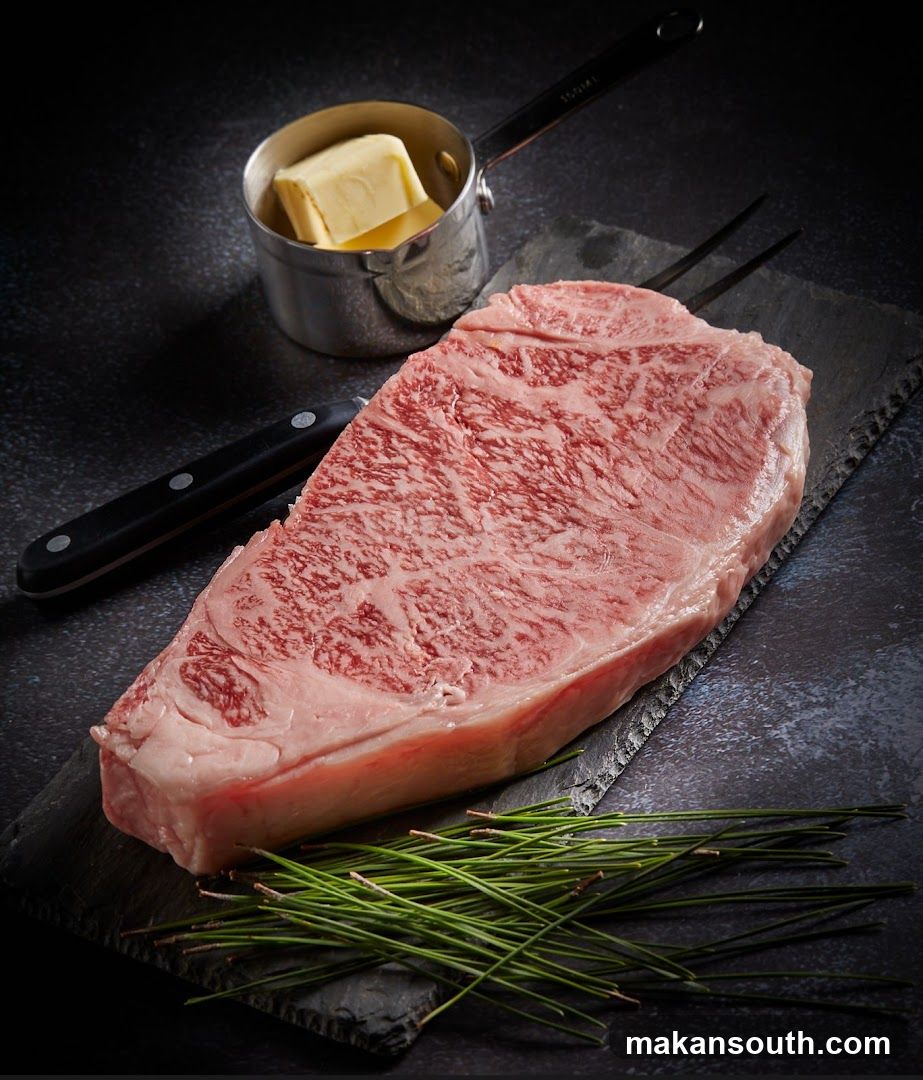 Raw Steak with Butter and Utensils