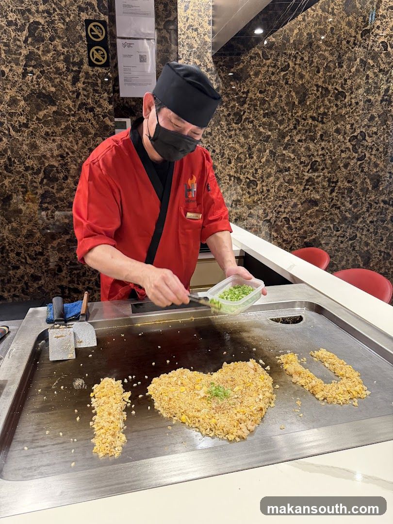 Chef preparing food on a grill