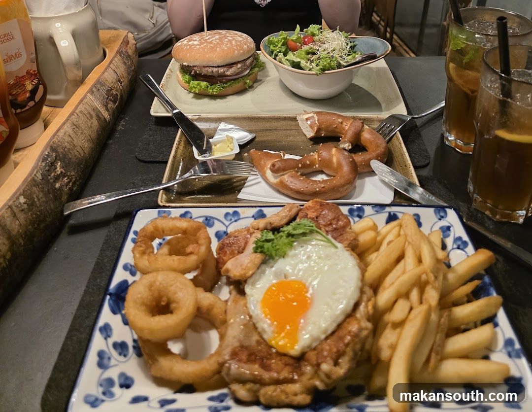 Hearty Meal with Burger, Schnitzel, and Pretzels