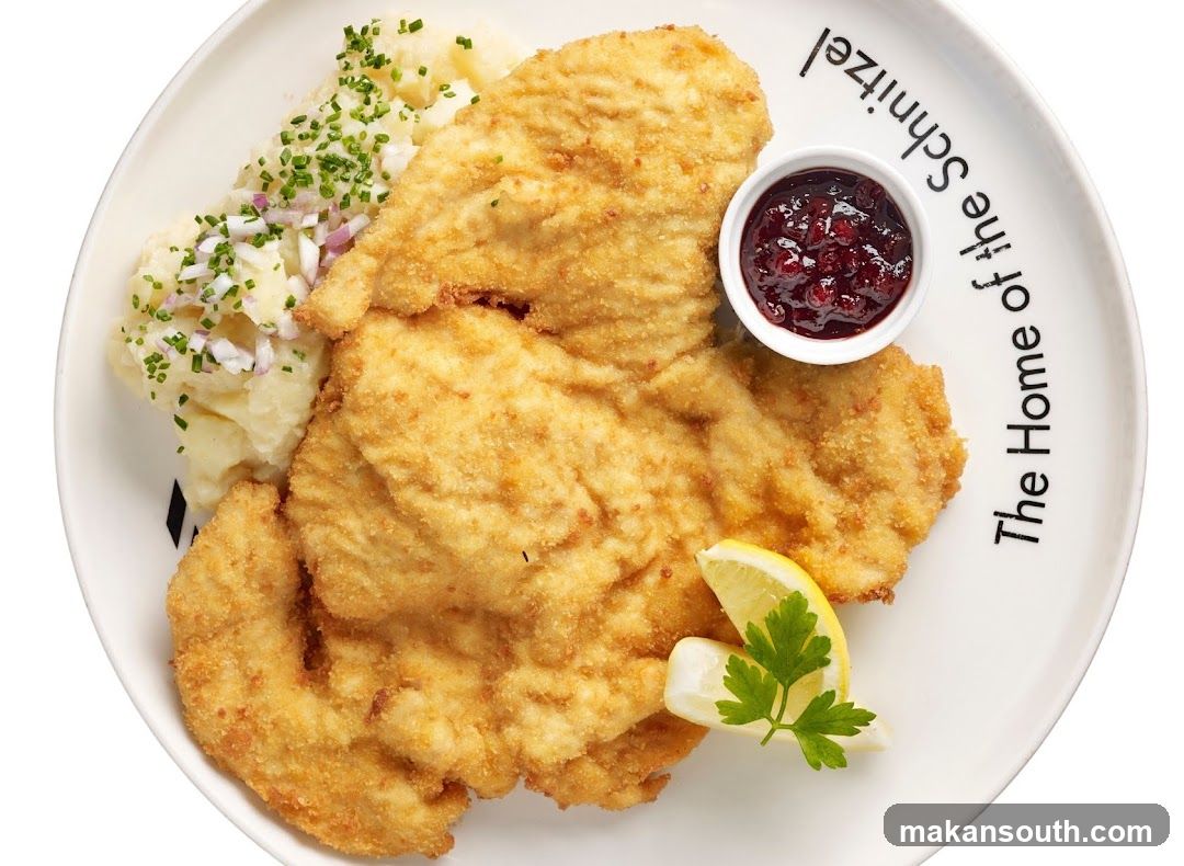 Schnitzel with Potatoes and Cranberry Sauce