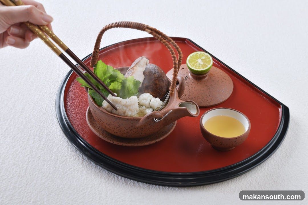 Steaming Hot Pot Dish with Chopsticks