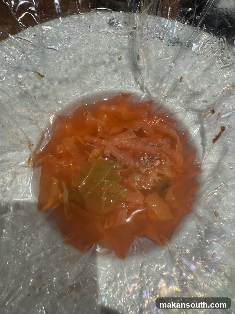 Chopped Cabbage in Orange Liquid