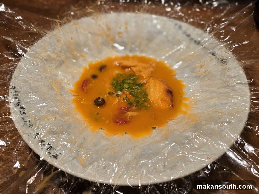 Close-up of a dish with sauce and toppings