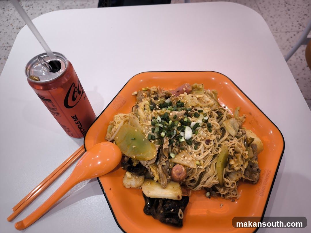 Noodles with a can of Coca-Cola