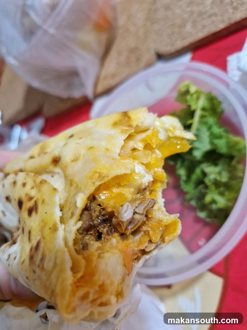 Close-up of a partially eaten burrito