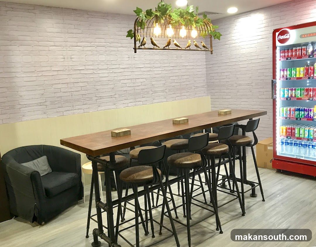 Cafe Interior with High Table and Coca-Cola Fridge