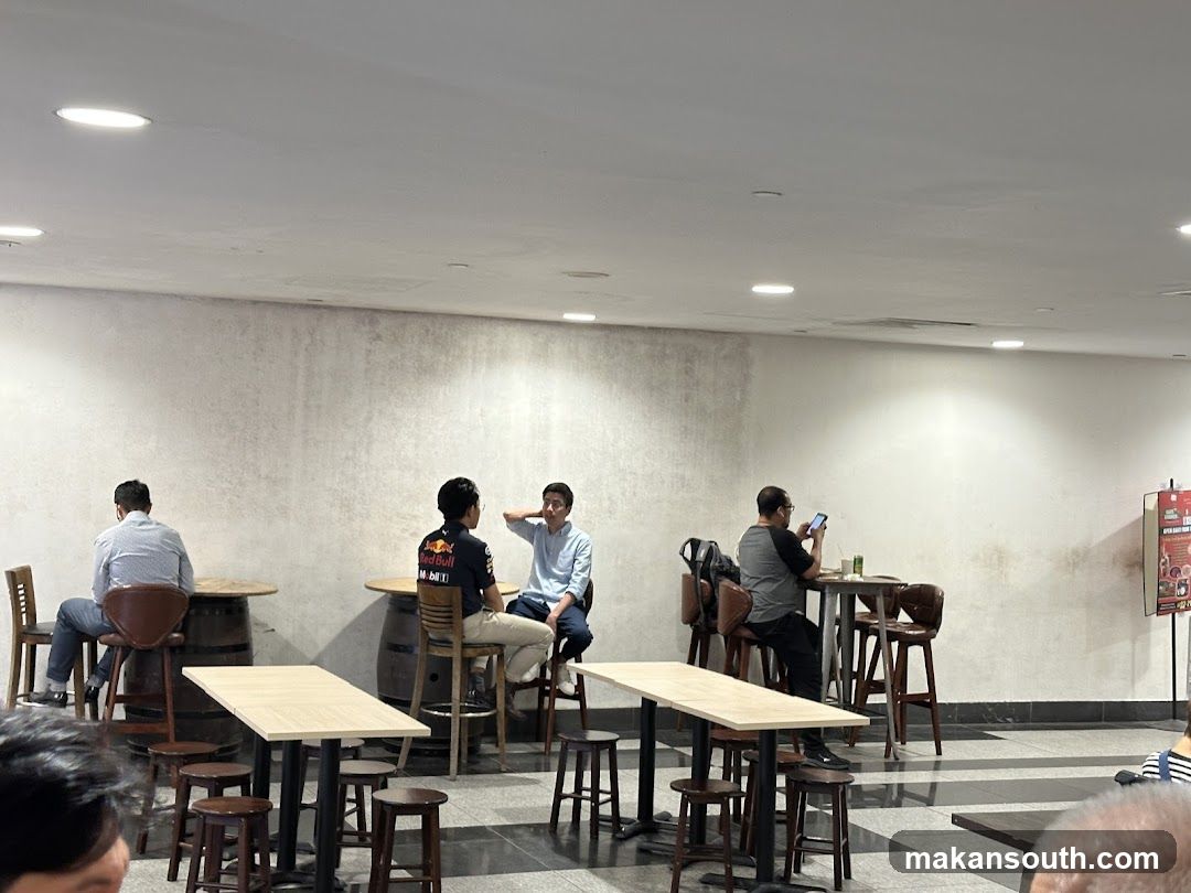 People sitting at tables in a cafe