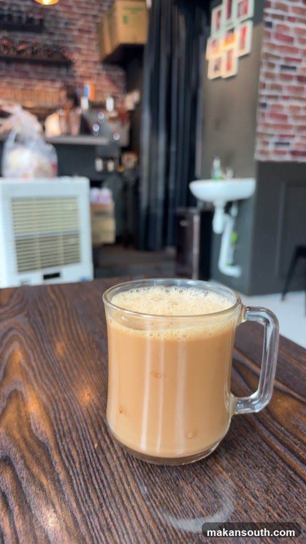 Tea in a glass mug on a wooden table