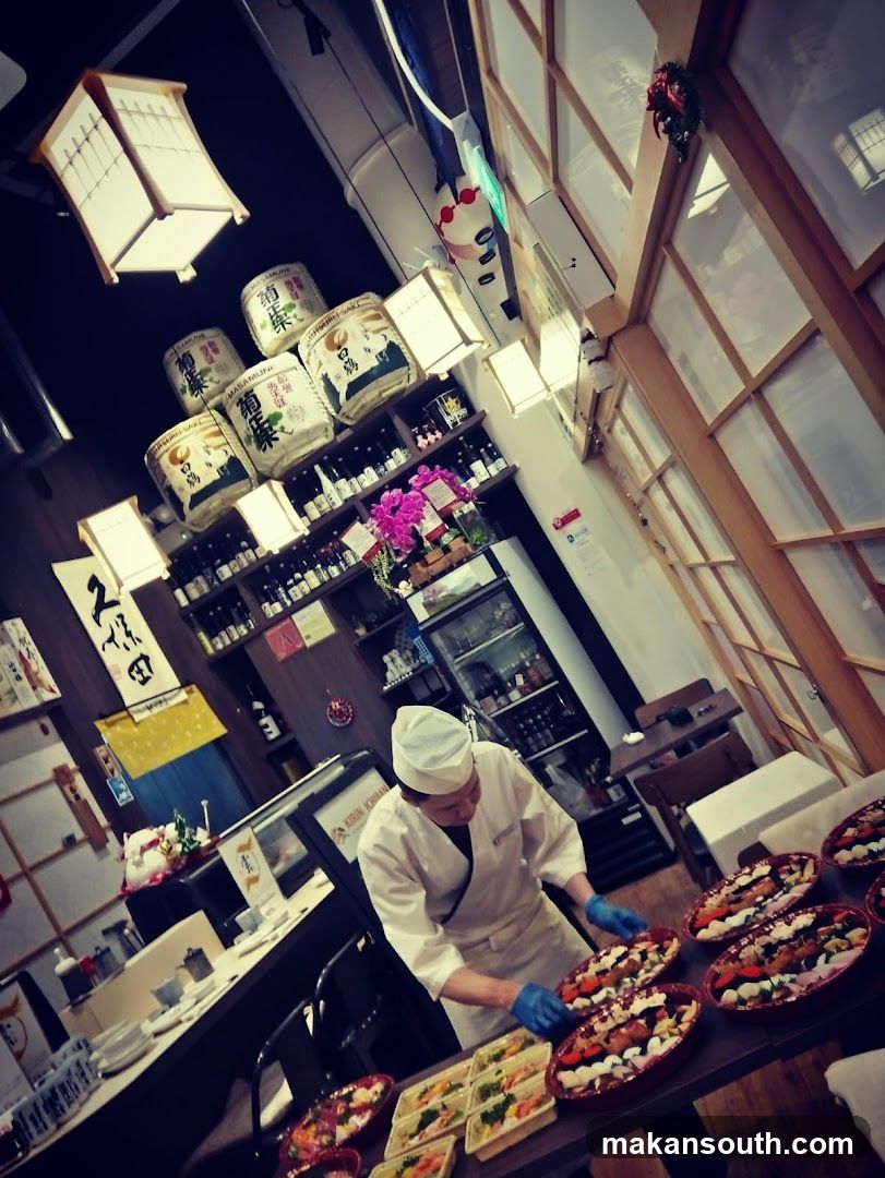 Chef preparing sushi boxes
