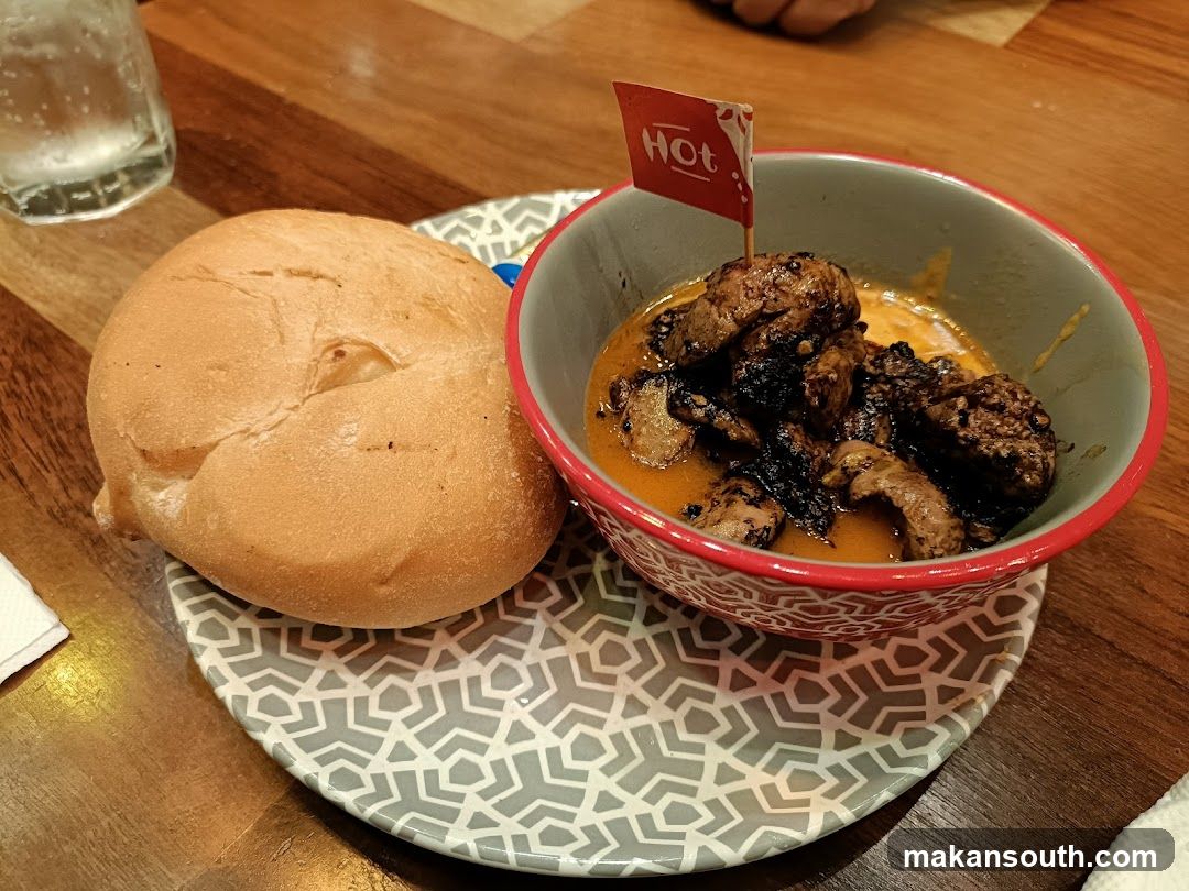 Spicy Meat Dish with Bun