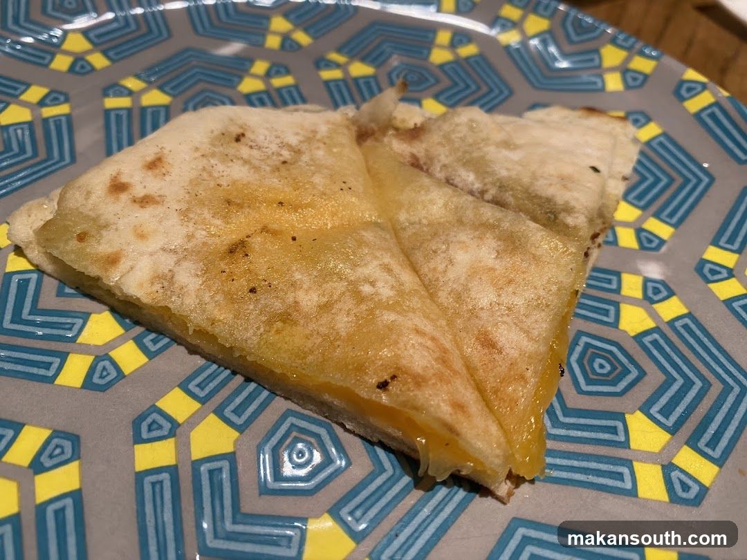 Cheese-filled flatbread on a patterned plate