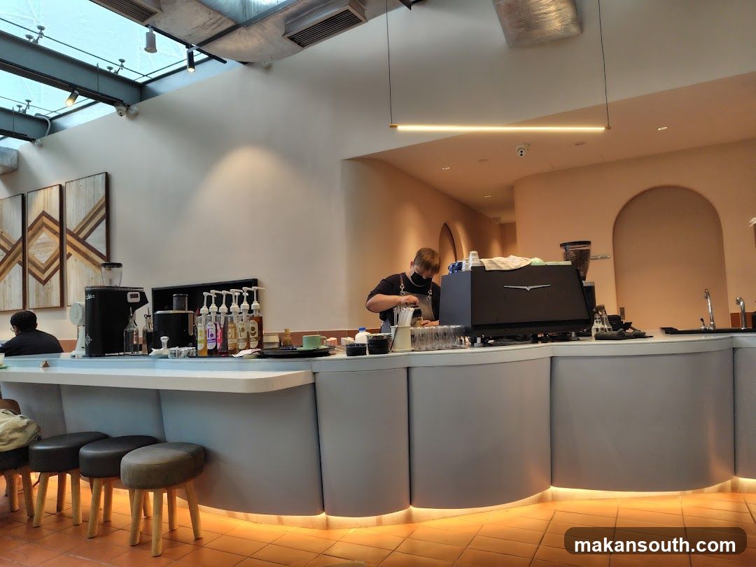 Barista preparing coffee at a counter