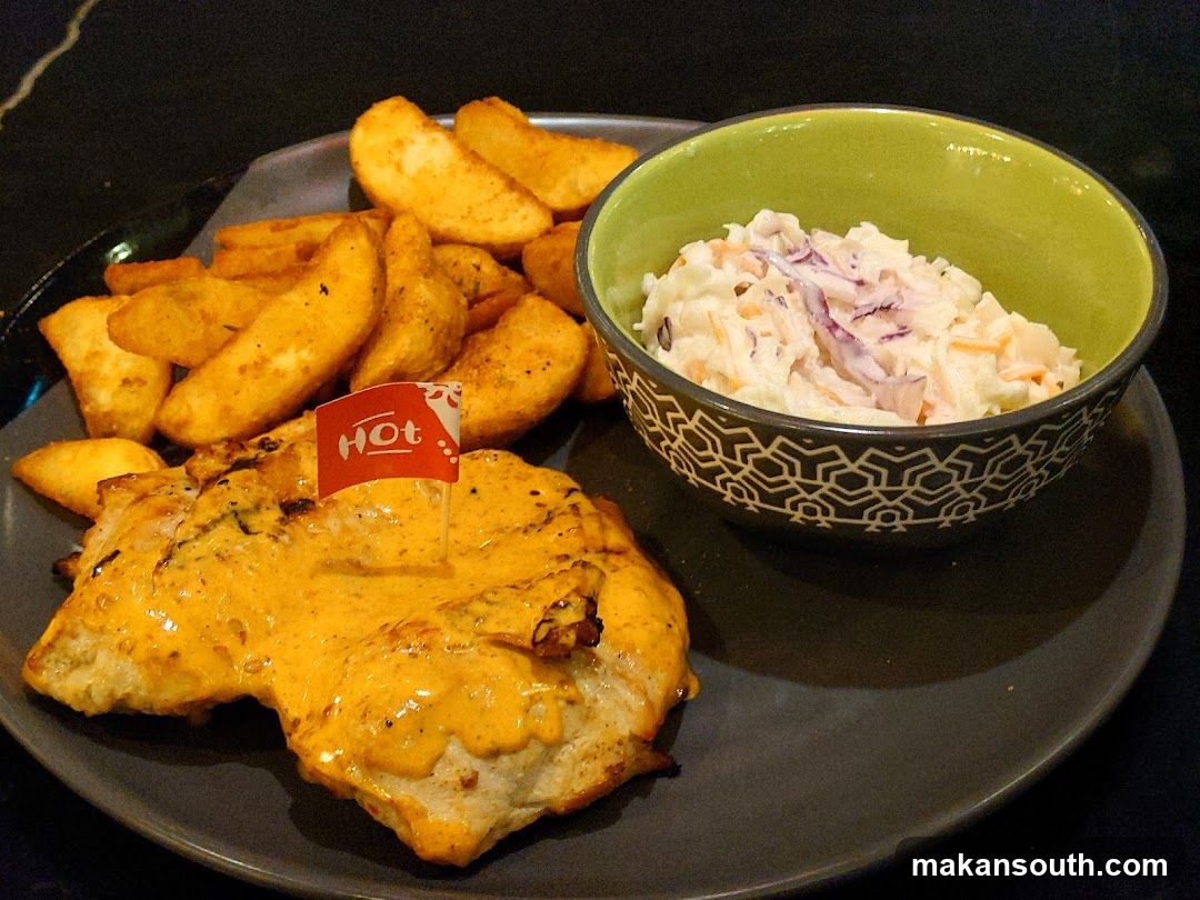 Chicken with wedges and coleslaw