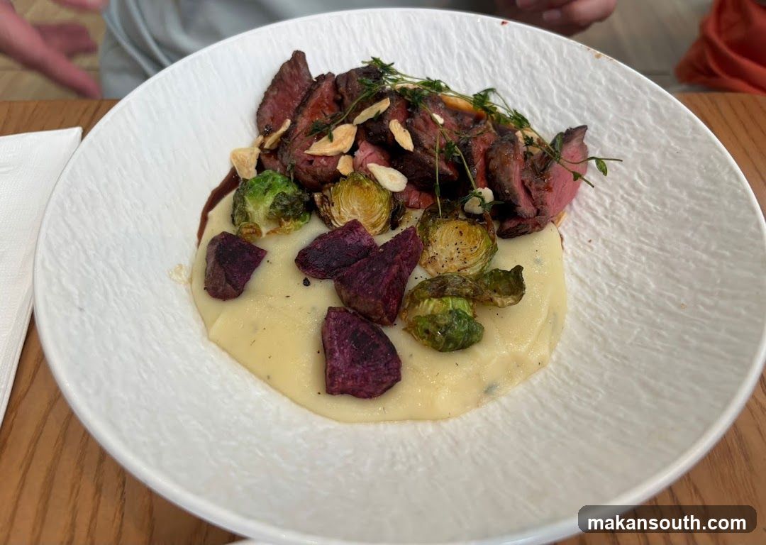Sliced steak with mashed potatoes and vegetables