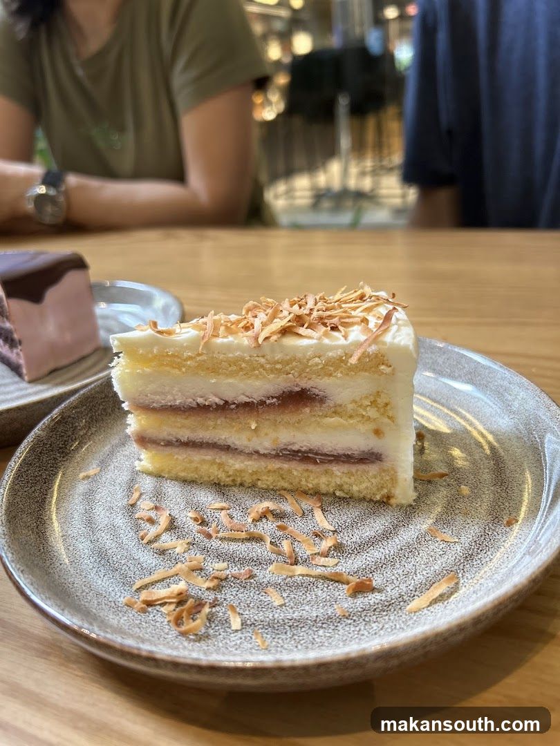 Slice of cake with coconut shavings