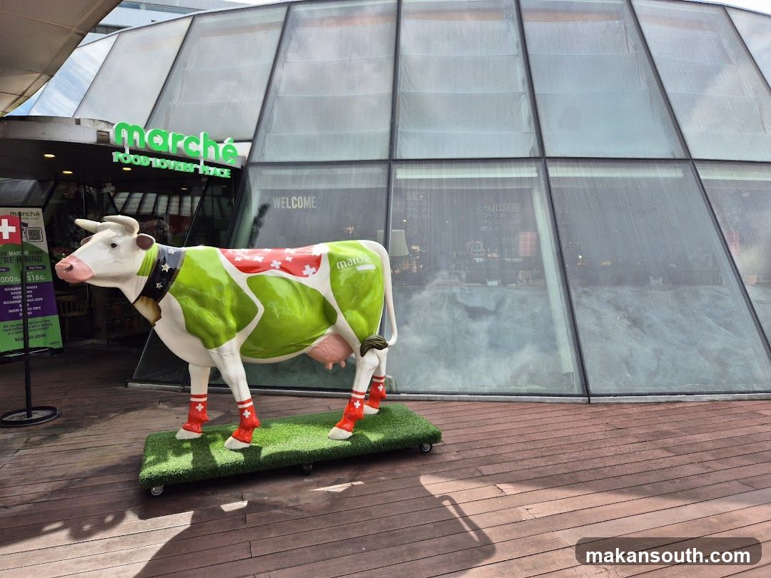 Decorated Cow Statue Outside Marche Restaurant