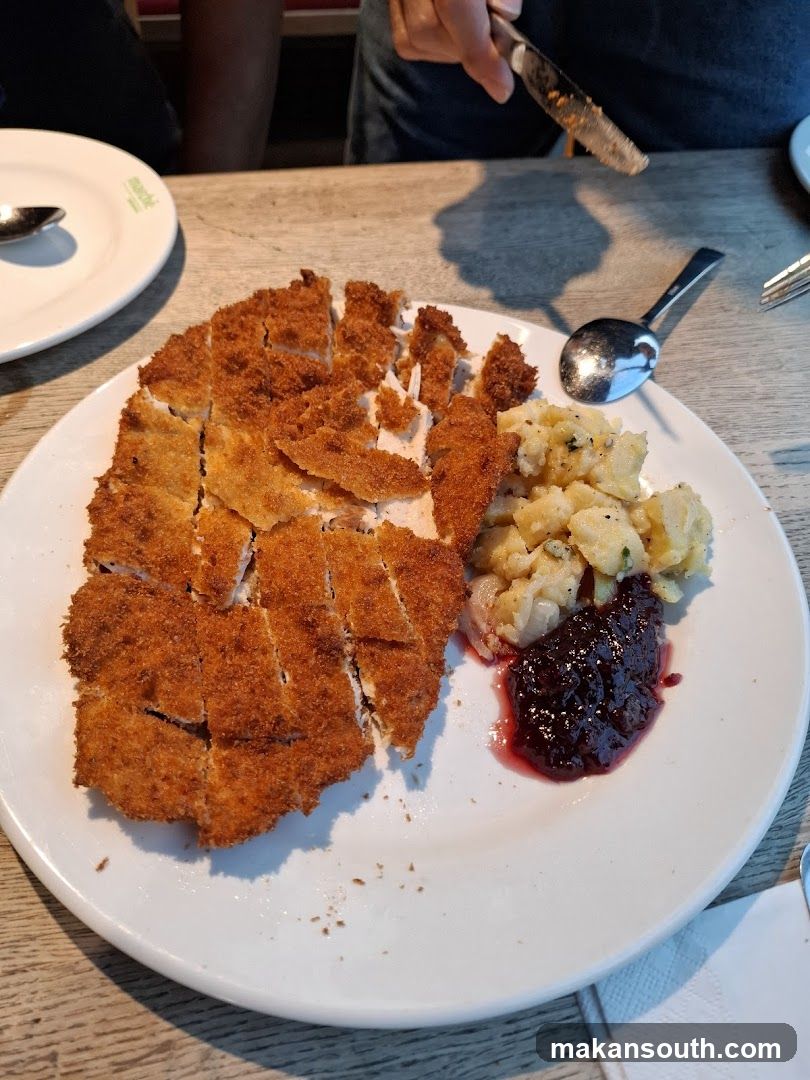 Breaded Chicken with Potato Salad and Cranberry Sauce