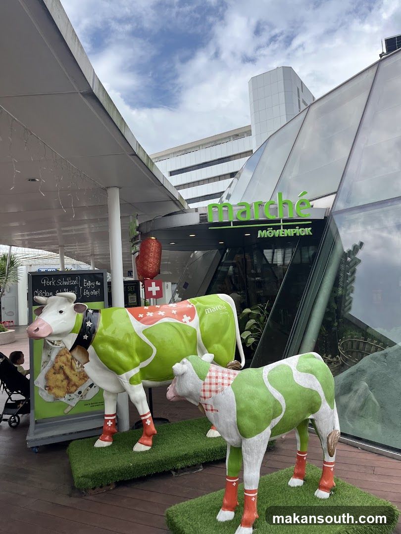 Marché Mövenpick Restaurant Entrance with Cow Statues