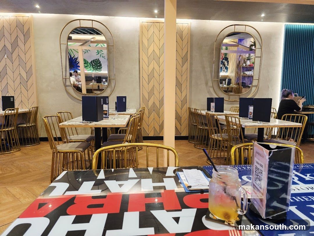 Restaurant Interior with Gold Chairs and Mirrors
