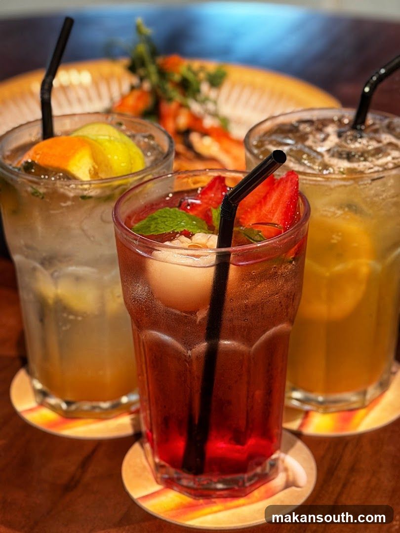 Three refreshing drinks on a wooden table