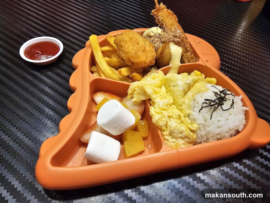 Dinosaur-shaped plate with food