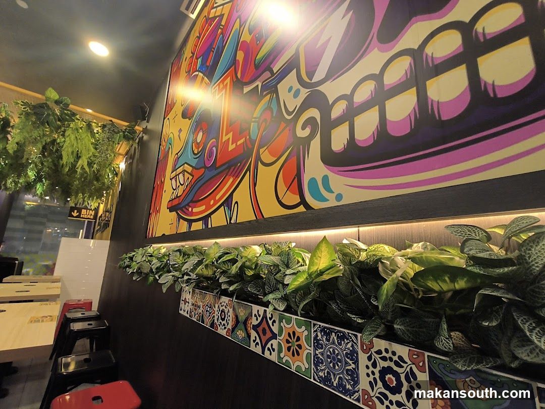 Restaurant Interior with Colorful Mural and Plants