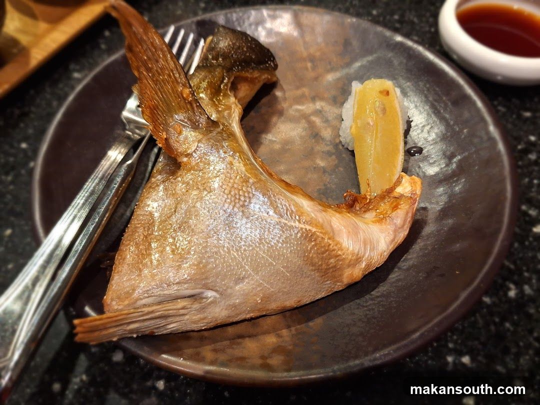 Grilled Fish Head with Lemon and Sushi