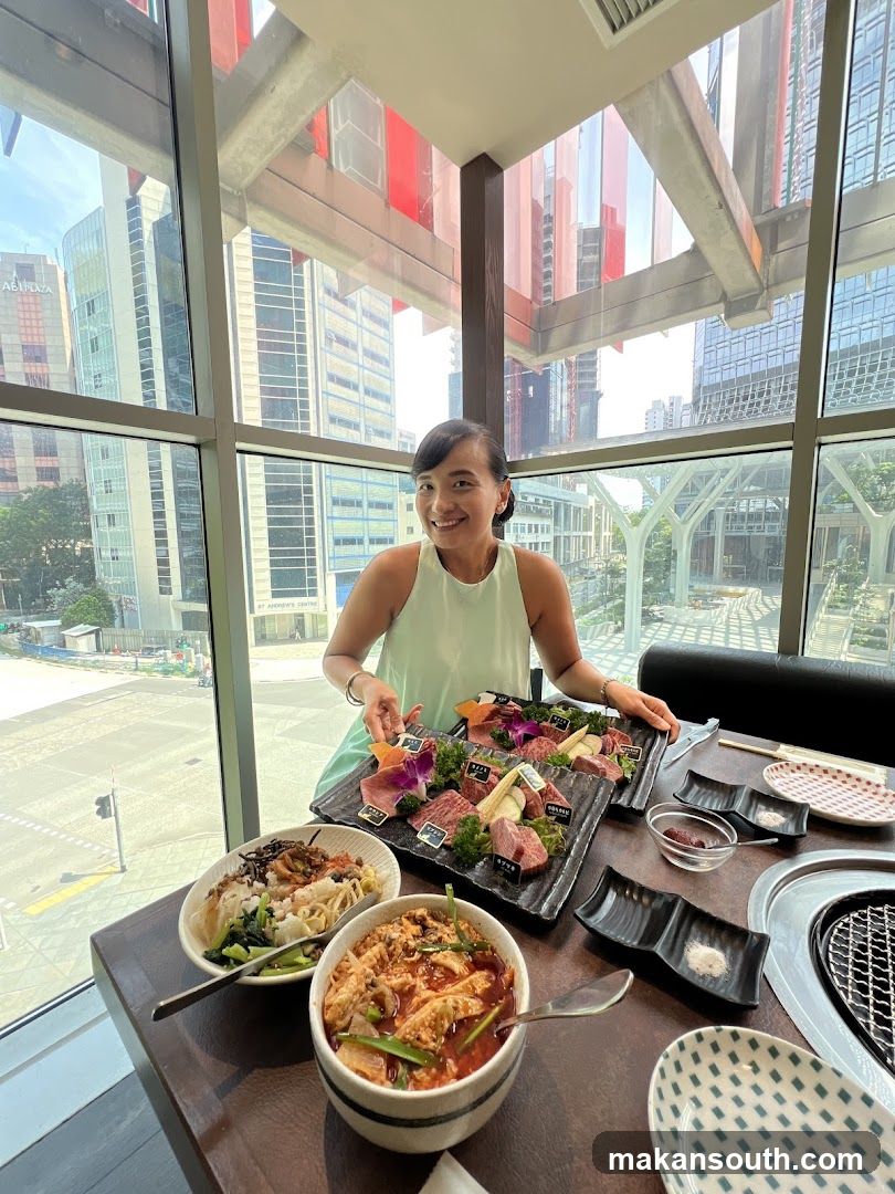 Woman with a spread of food at a restaurant