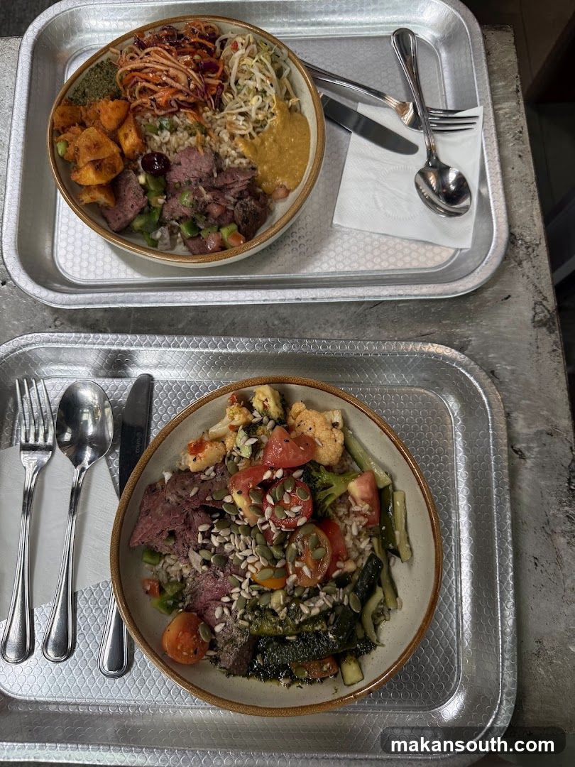 Two bowls of food on trays