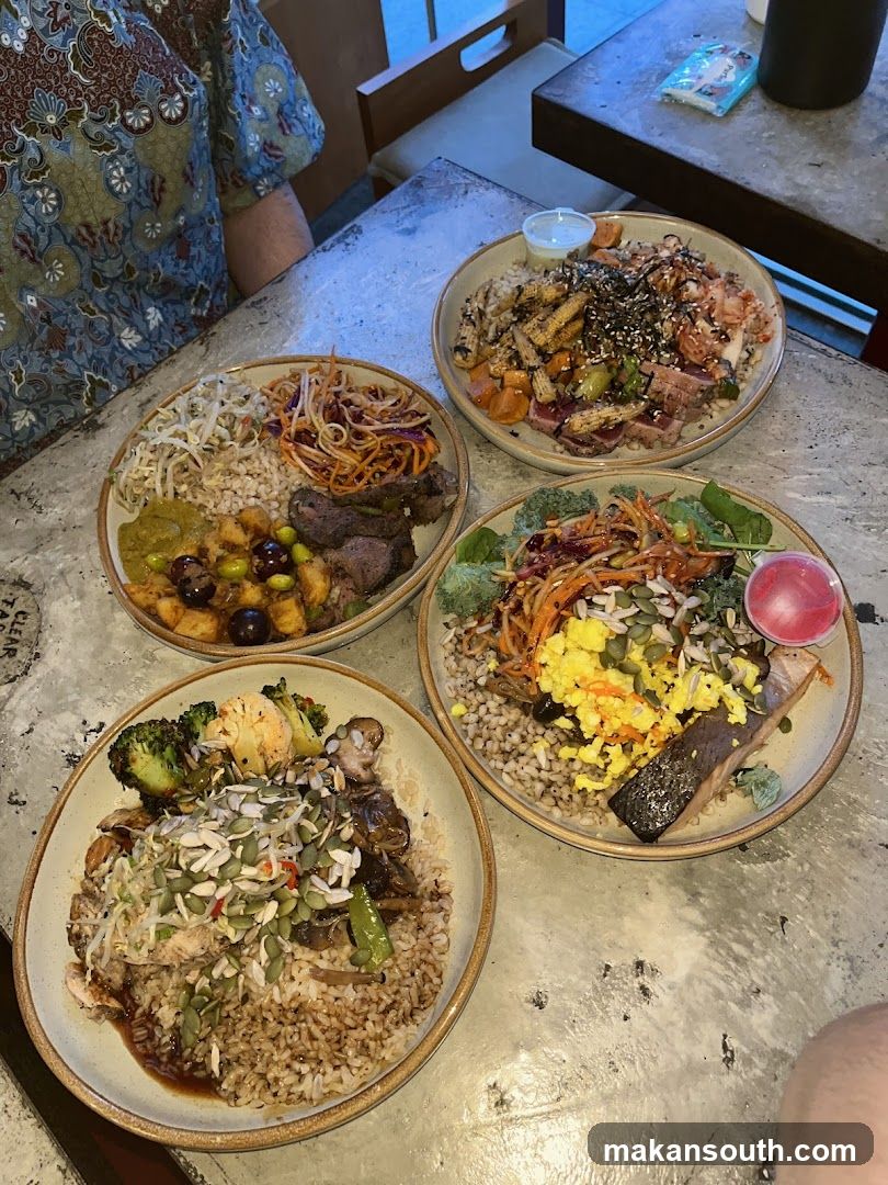Four bowls of food on a table
