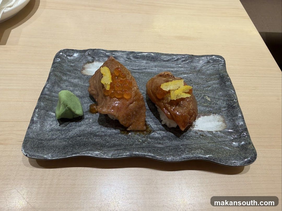 Two pieces of sushi on a plate