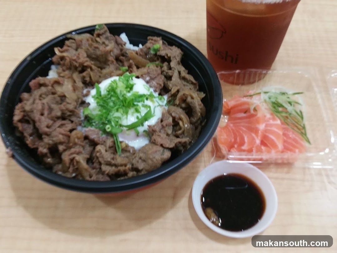 Beef bowl with salmon sashimi and iced tea