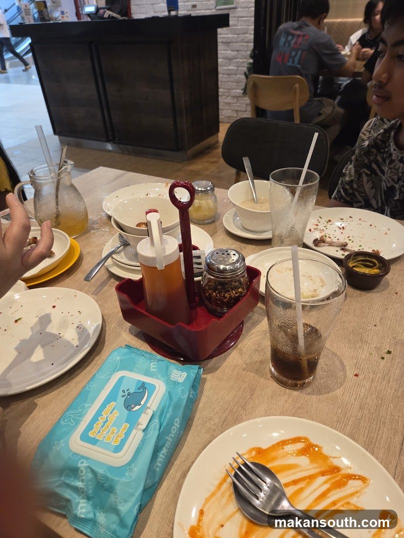 Table with leftover food and wet wipes