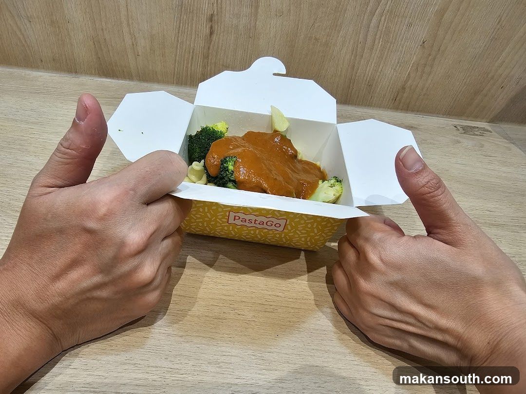 Pasta dish in a takeout box