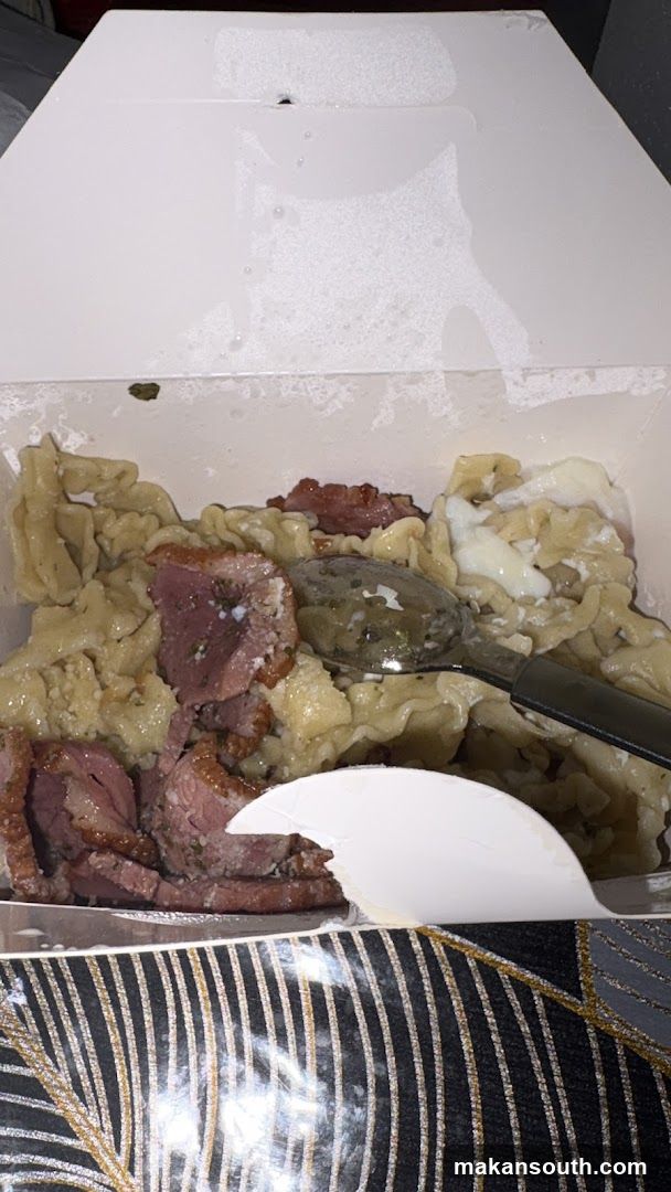 Takeout Container with Pasta and Meat