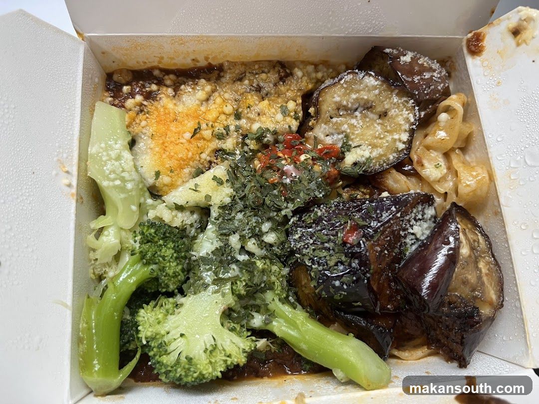 Takeout Container with Pasta, Eggplant, and Broccoli