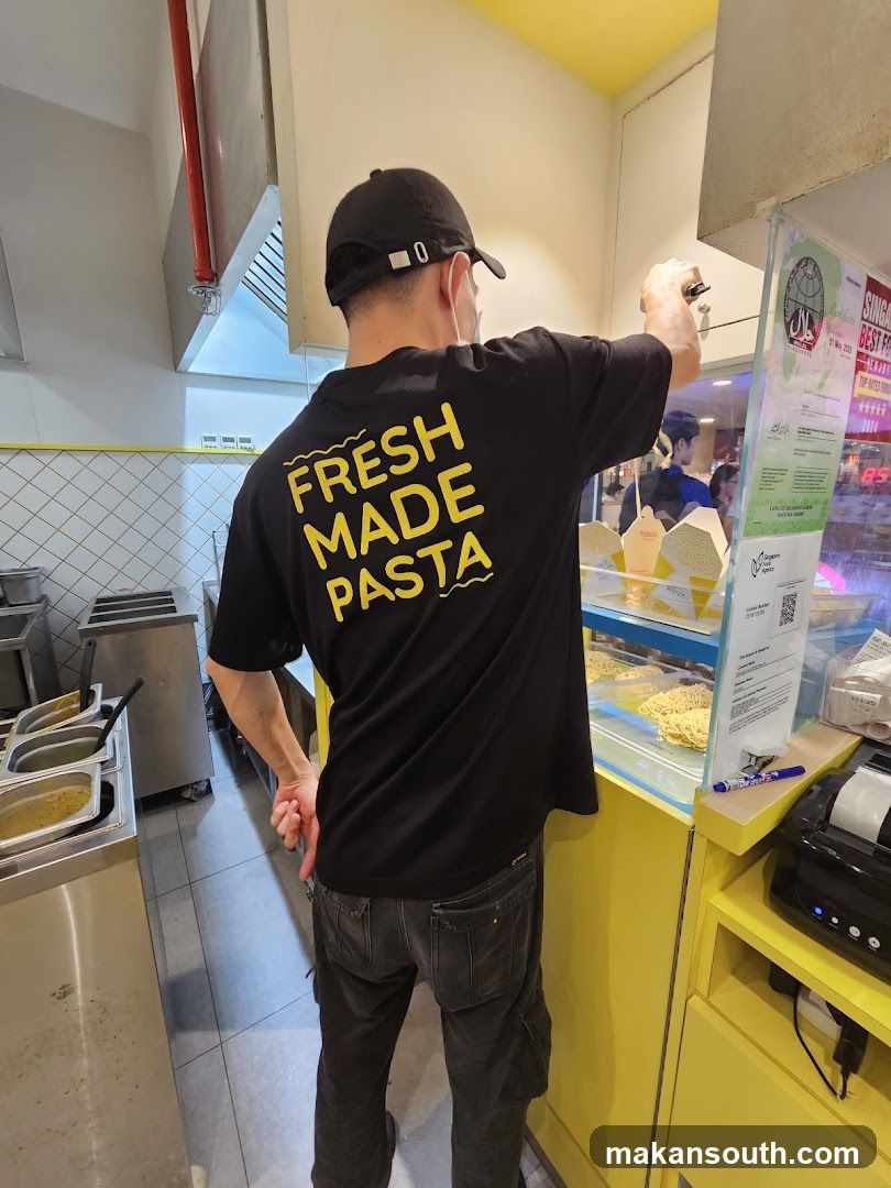 Staff member in a pasta shop