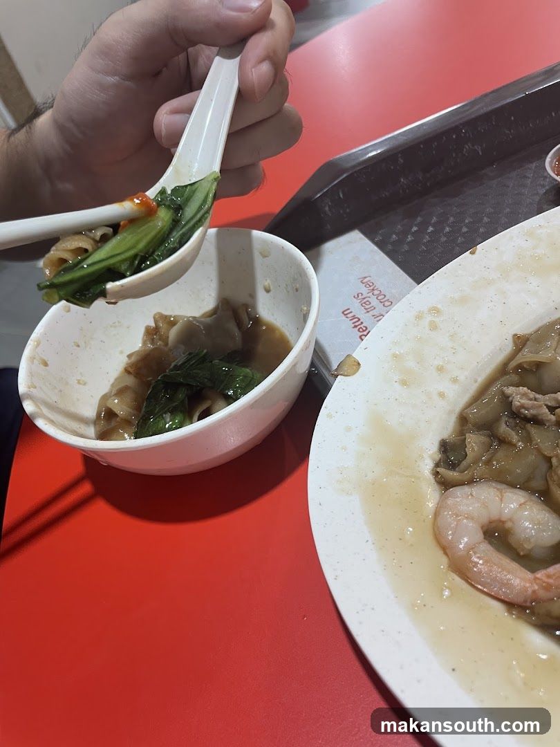 Person eating noodles