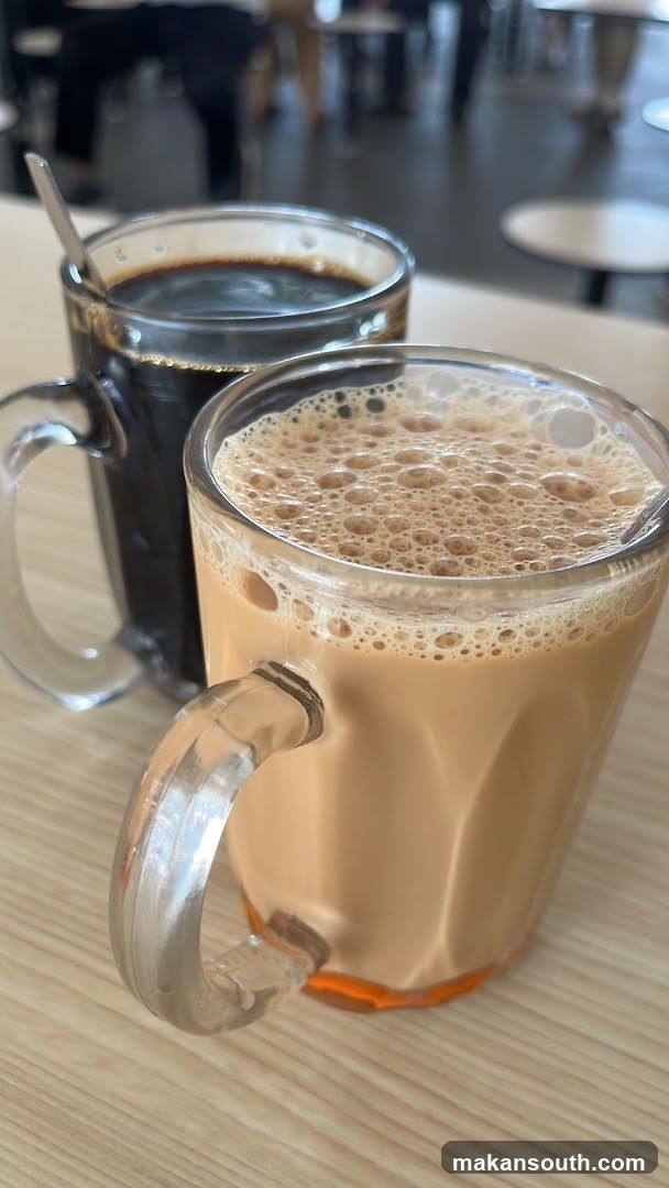 Two Mugs of Beverages