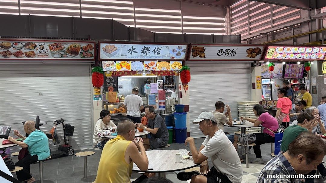 Food court stalls with patrons