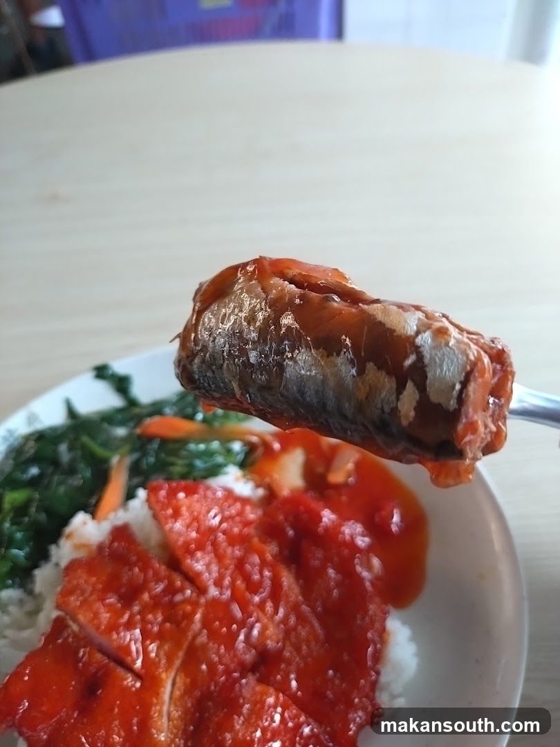 Close-up of a meal with rice, meat, and vegetables