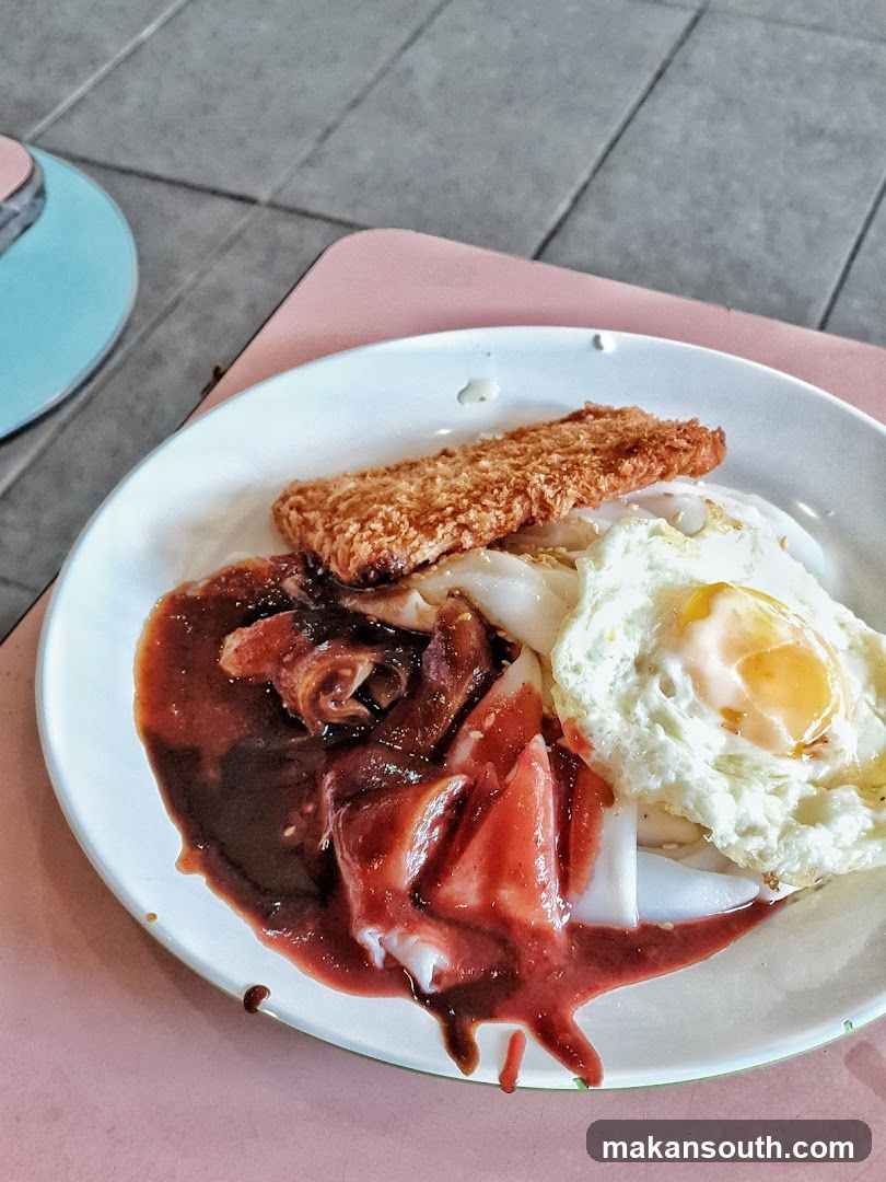 Fried Pork Chop with Rice Noodles and Fried Egg